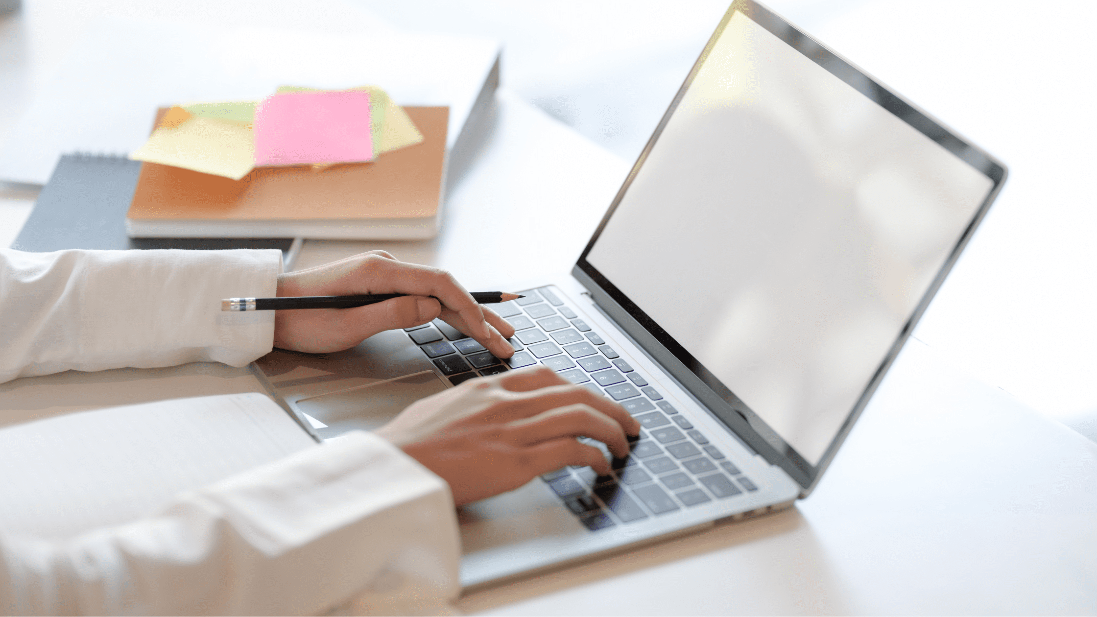 Someone using their laptop for studying the Internal Medicine Shelf Exam.